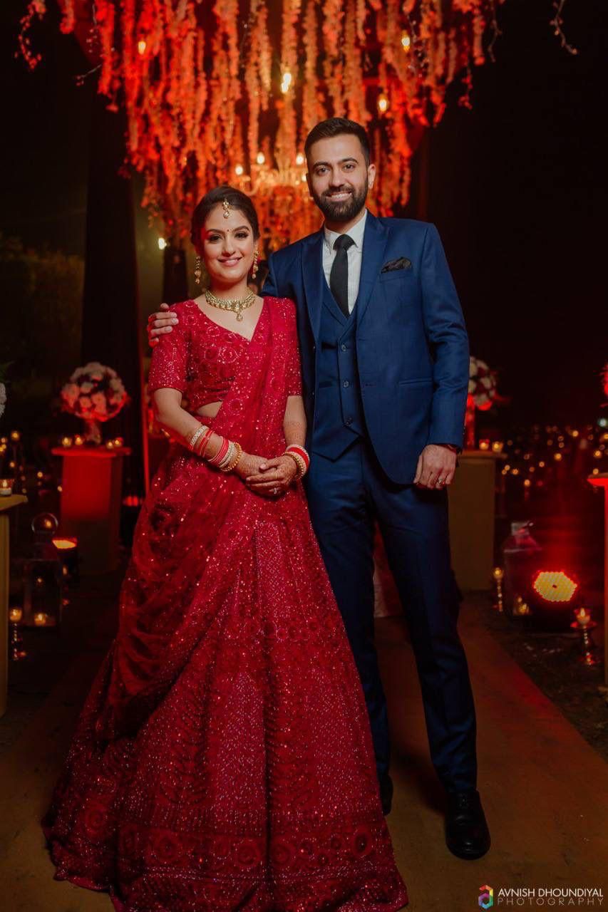 red lehenga matching groom dress Premium Designer Red Bridal Lehenga Wedding Wear has Heavily Embellished Red  Bridal Lehenga in Front Open Gown style paired with Net Embellished  Dupatta. Same Black Sherwani for Groom can be separately customizable